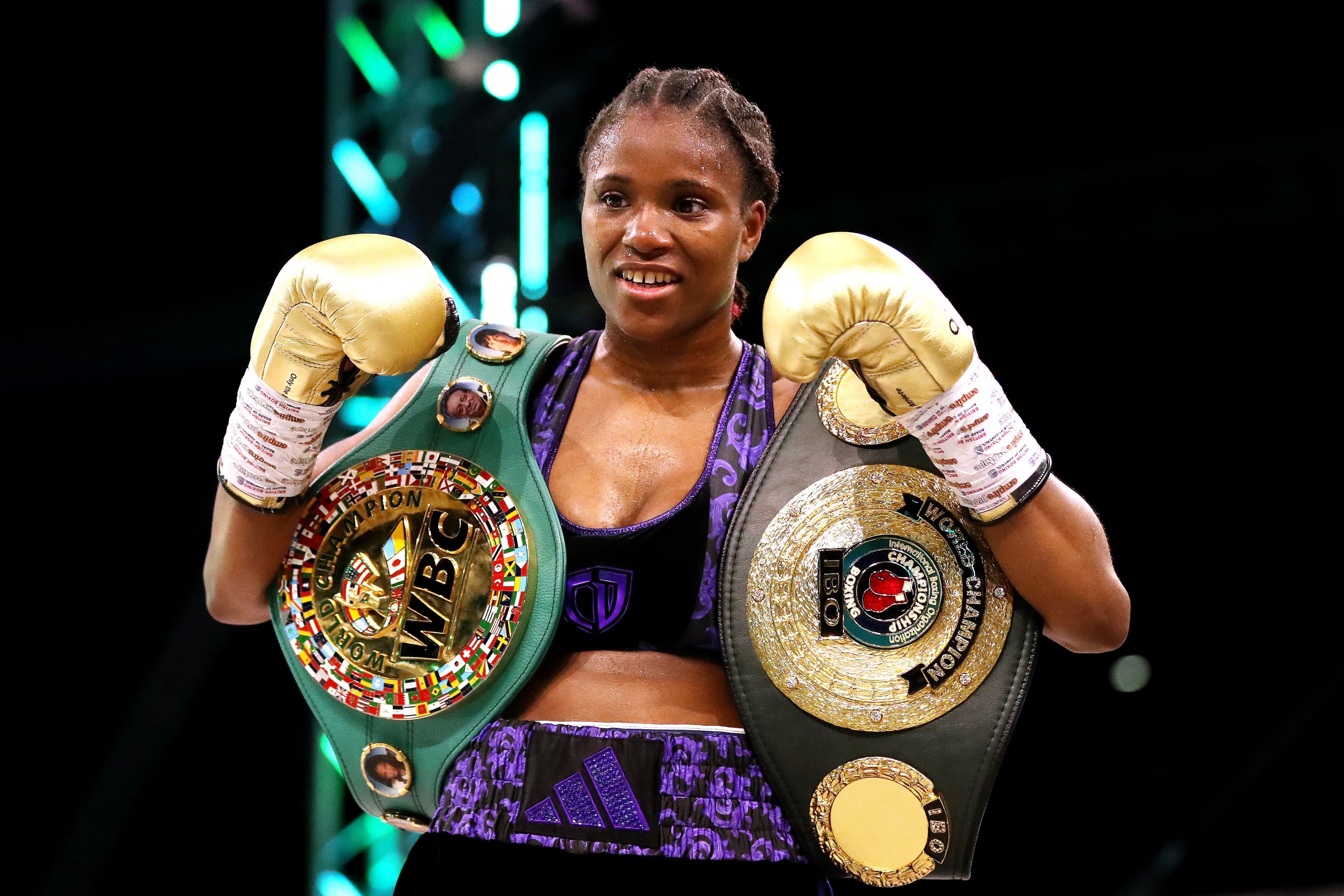 Caroline Dubois poses for a photo with the title belt after victory over Maira Moneo 