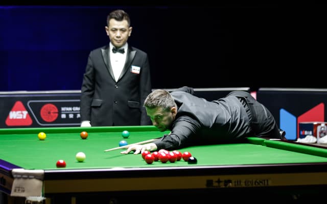 Mark Selby of England plays a shot in the first round match 