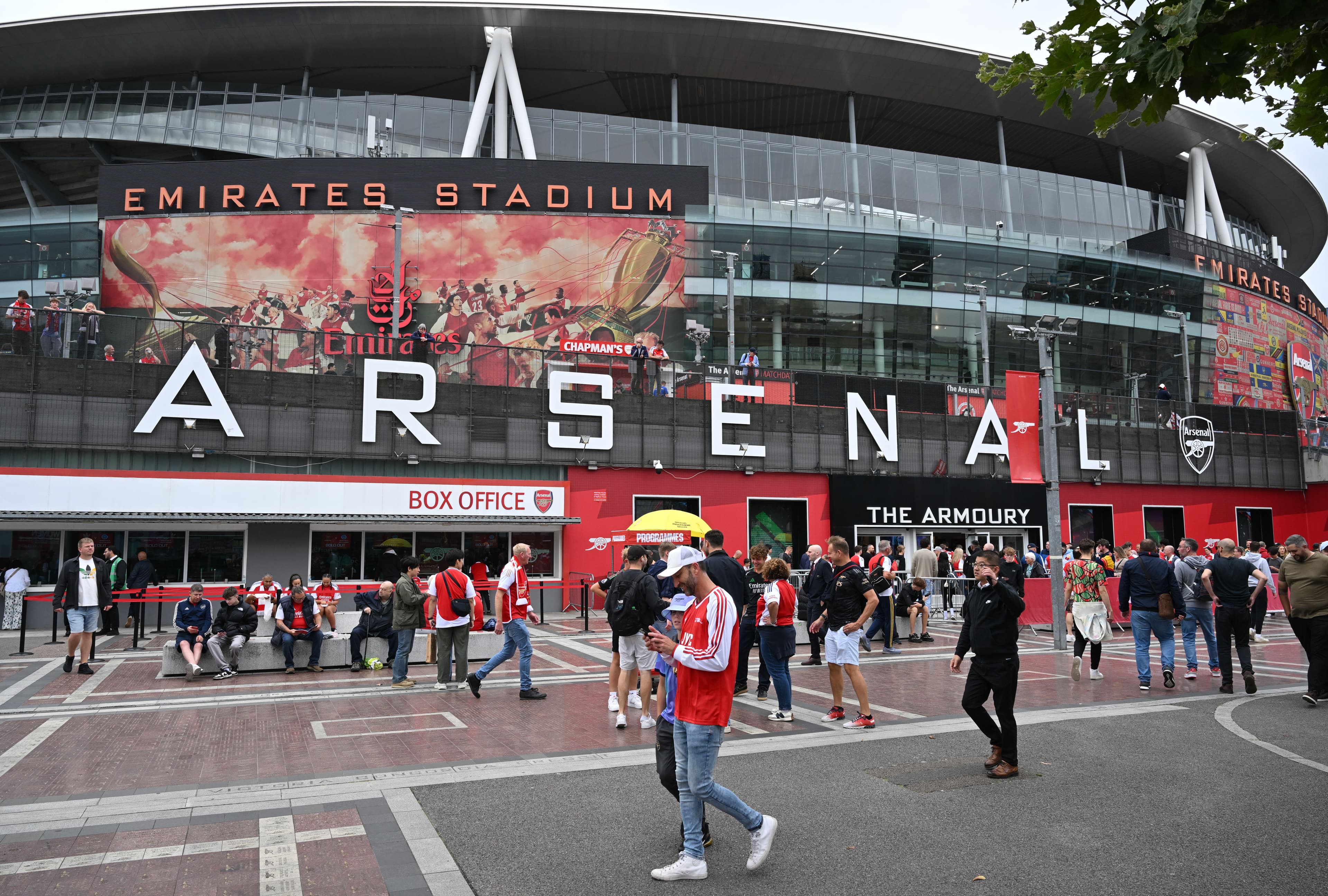 Arsenal fans arrive at the stadium prior to the Premier League 