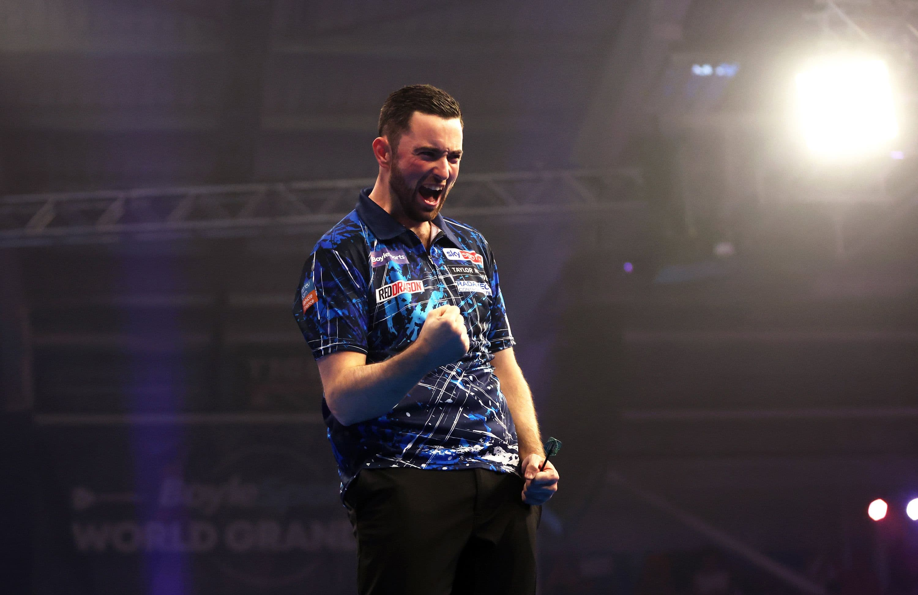 Luke Humphries of England celebrates victory over Ryan Joyce 