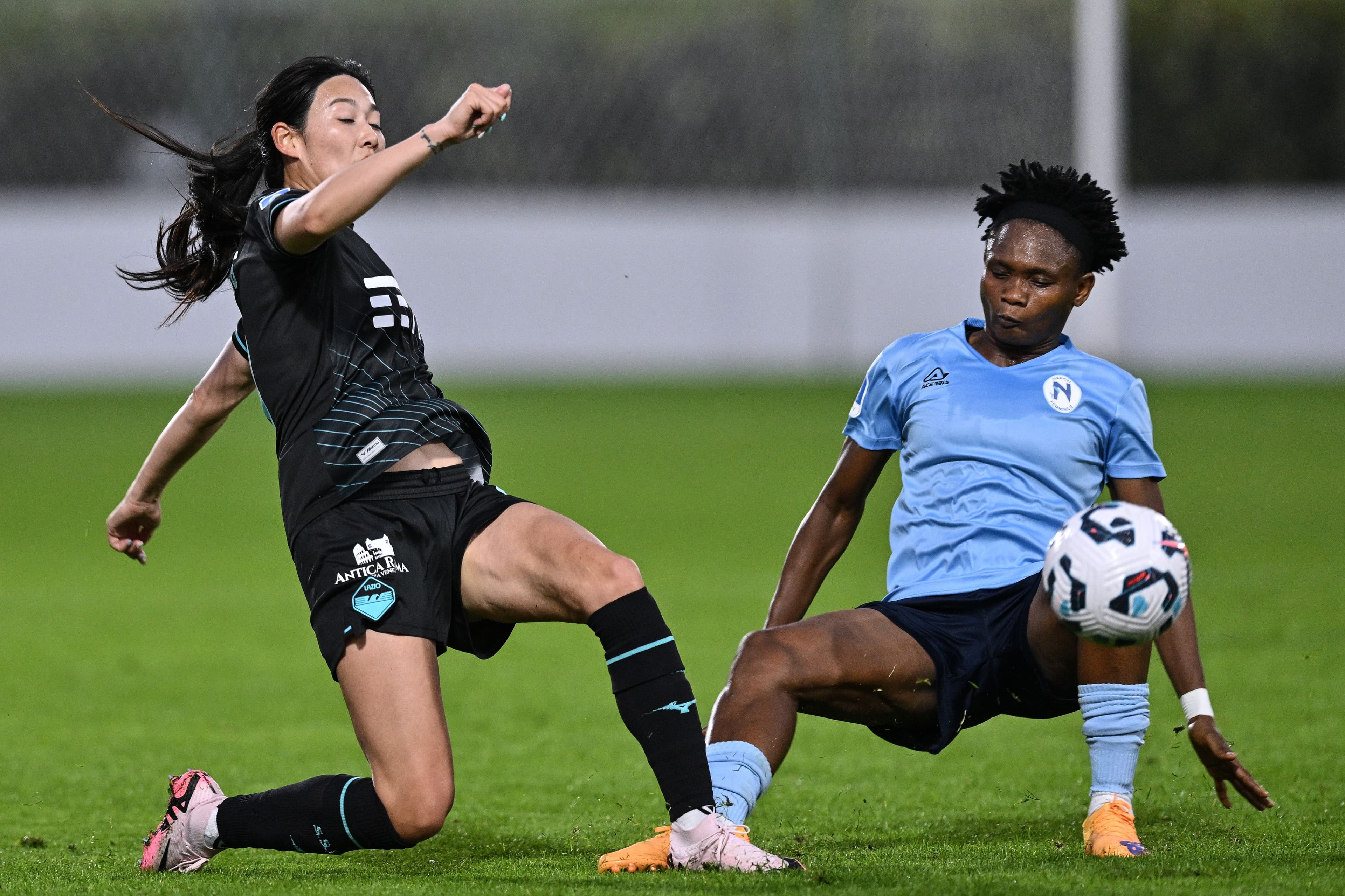 Lina Yang of SS Lazio competes for the ball with Olamide Adugbe of Napoli 