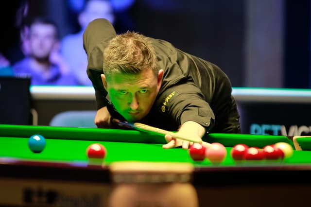 Kyren Wilson of England plays a shot in the Final match 