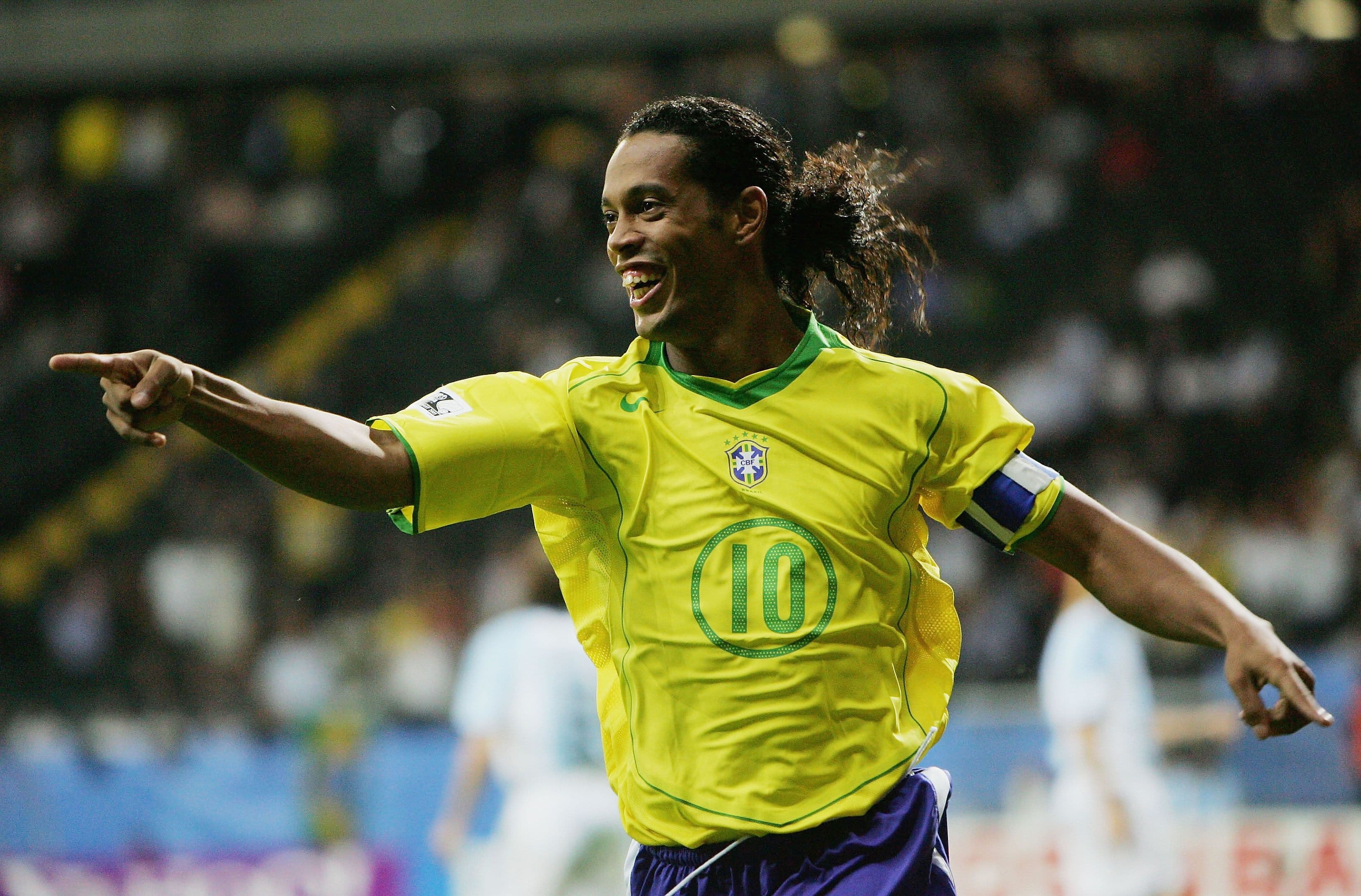 Ronaldinho of Brazil celebrates scoring his team's third goal