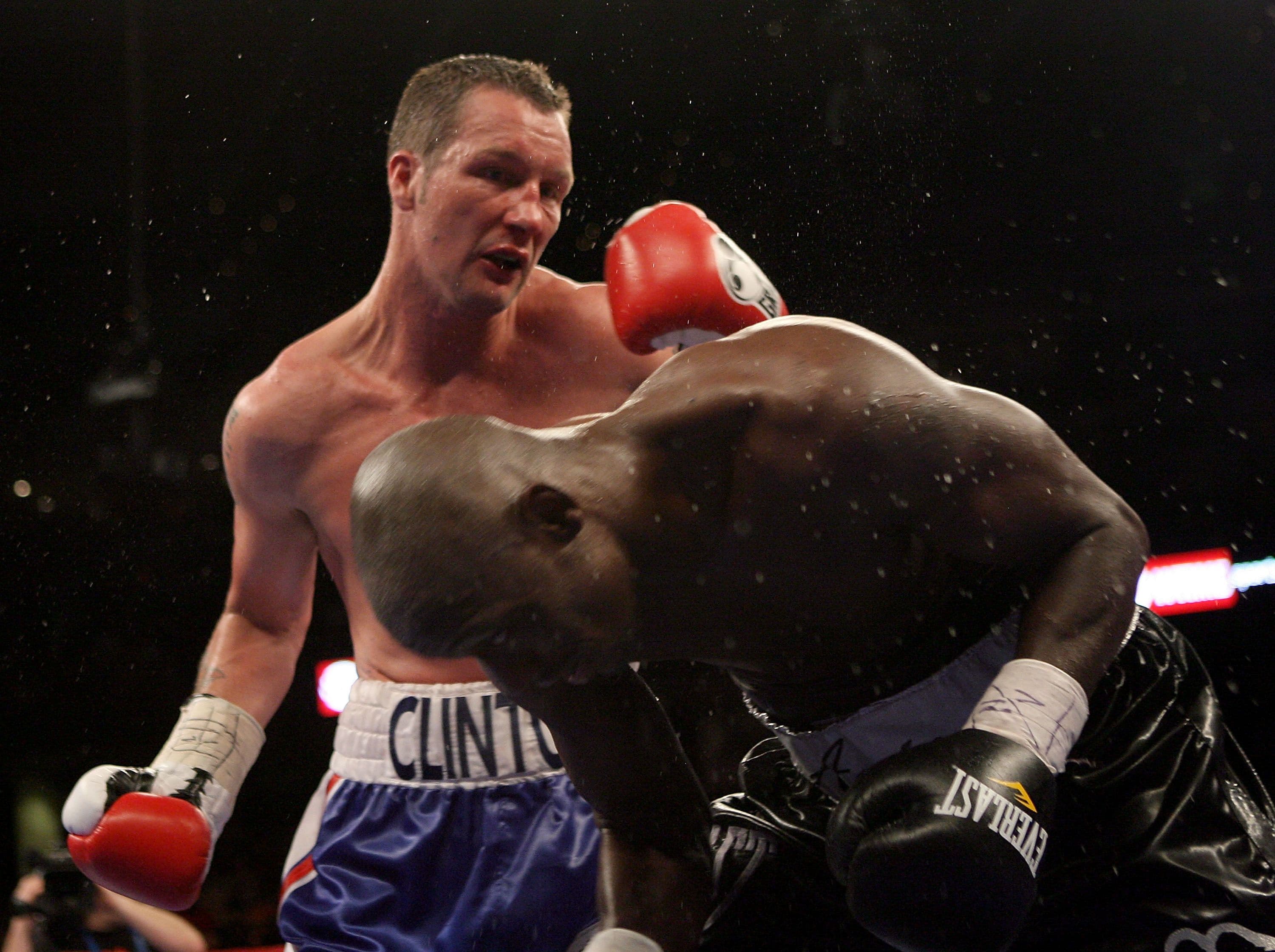 Action between Clinton Woods (L) and Antonio Tarver 