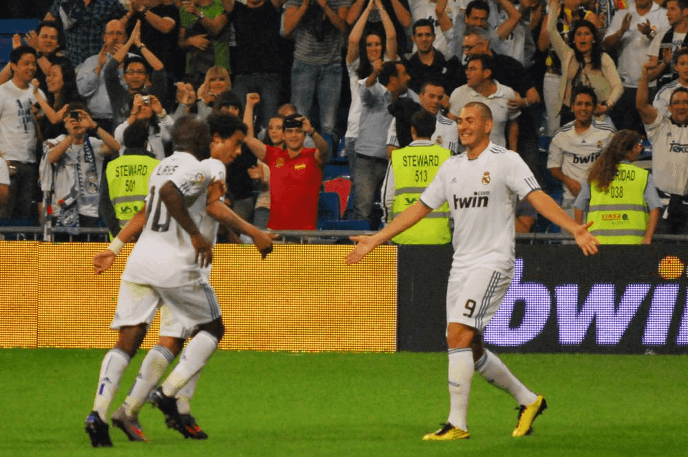 Karim Benzema and team-mates celebrate scoring against Espanyol in La Liga in 2010 // Photo: Alejandro Ramos - originally posted to Flickr // CC BY-SA 2.0 //