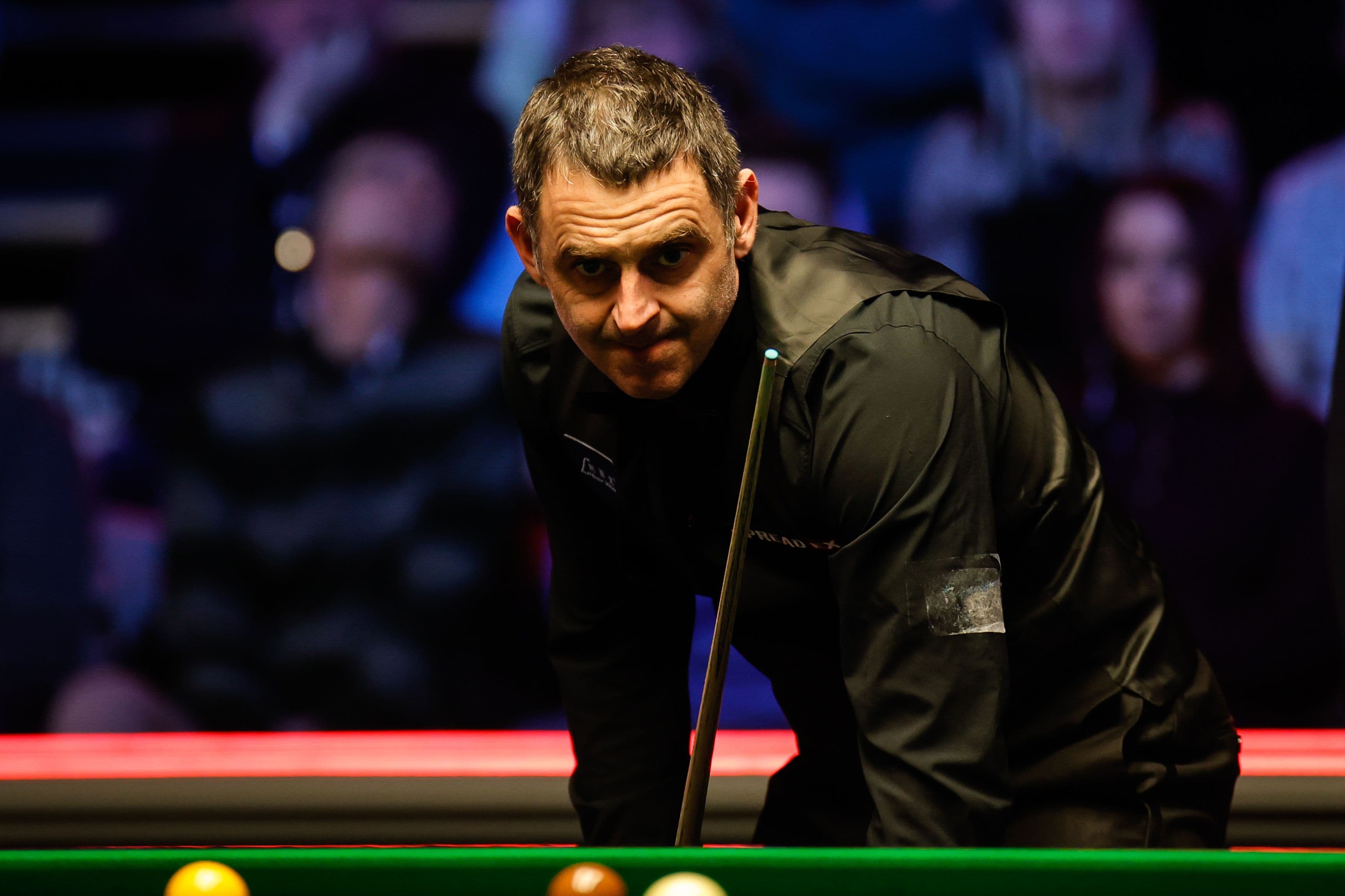 Snooker player wearing a black shirt