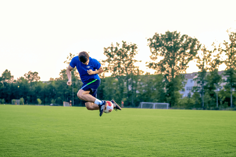 Man doing a football trick