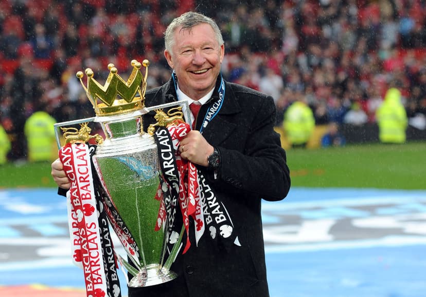 Manchester United's Scottish manager Alex Ferguson holds the Premier League trophy