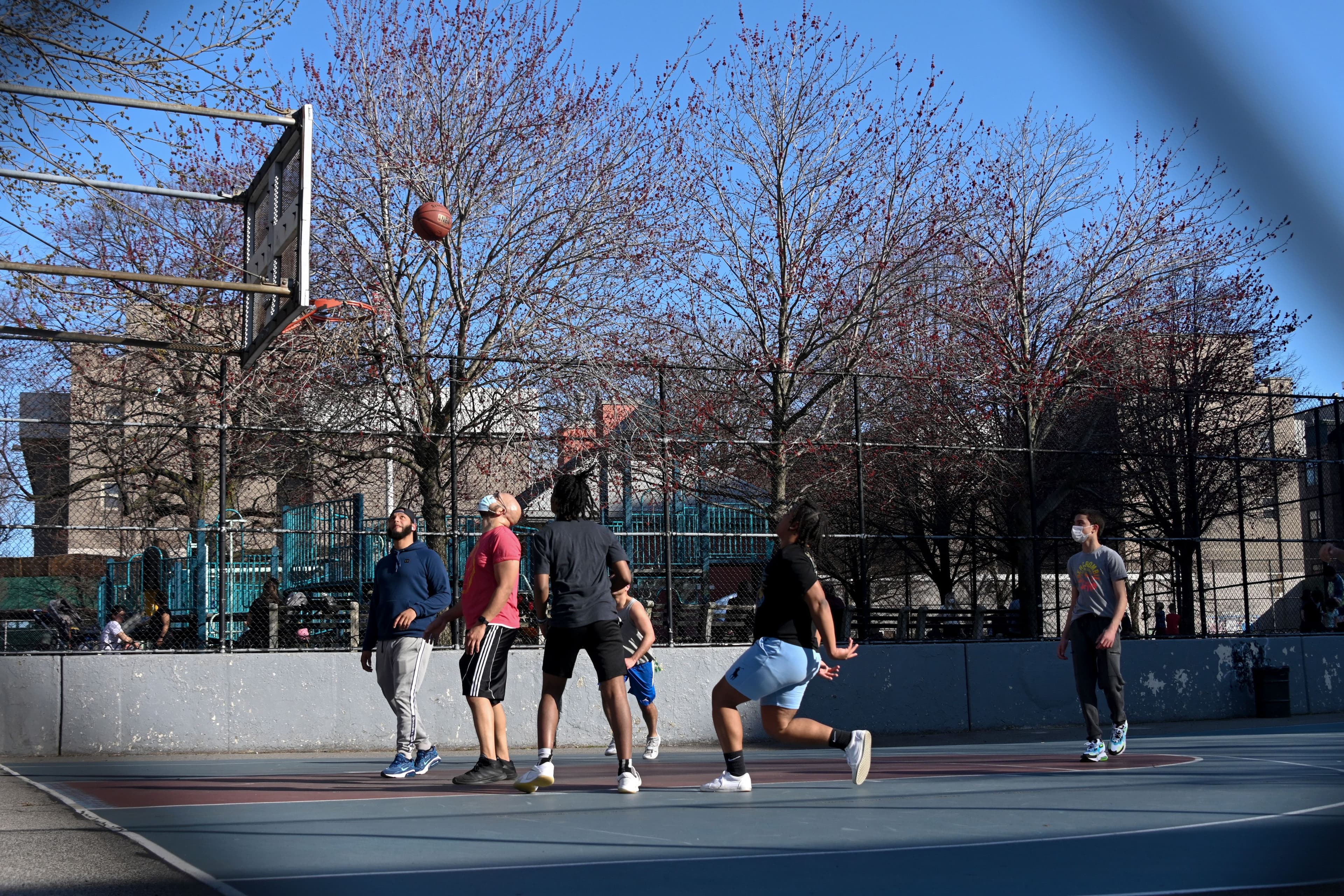 People play basketball in Williamsburg