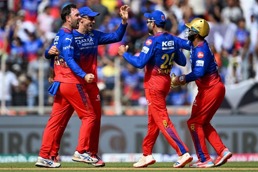 Royal Challengers Bengaluru's Glenn Maxwell celebrates with teammates during an IPL match versus Gujarat Titans