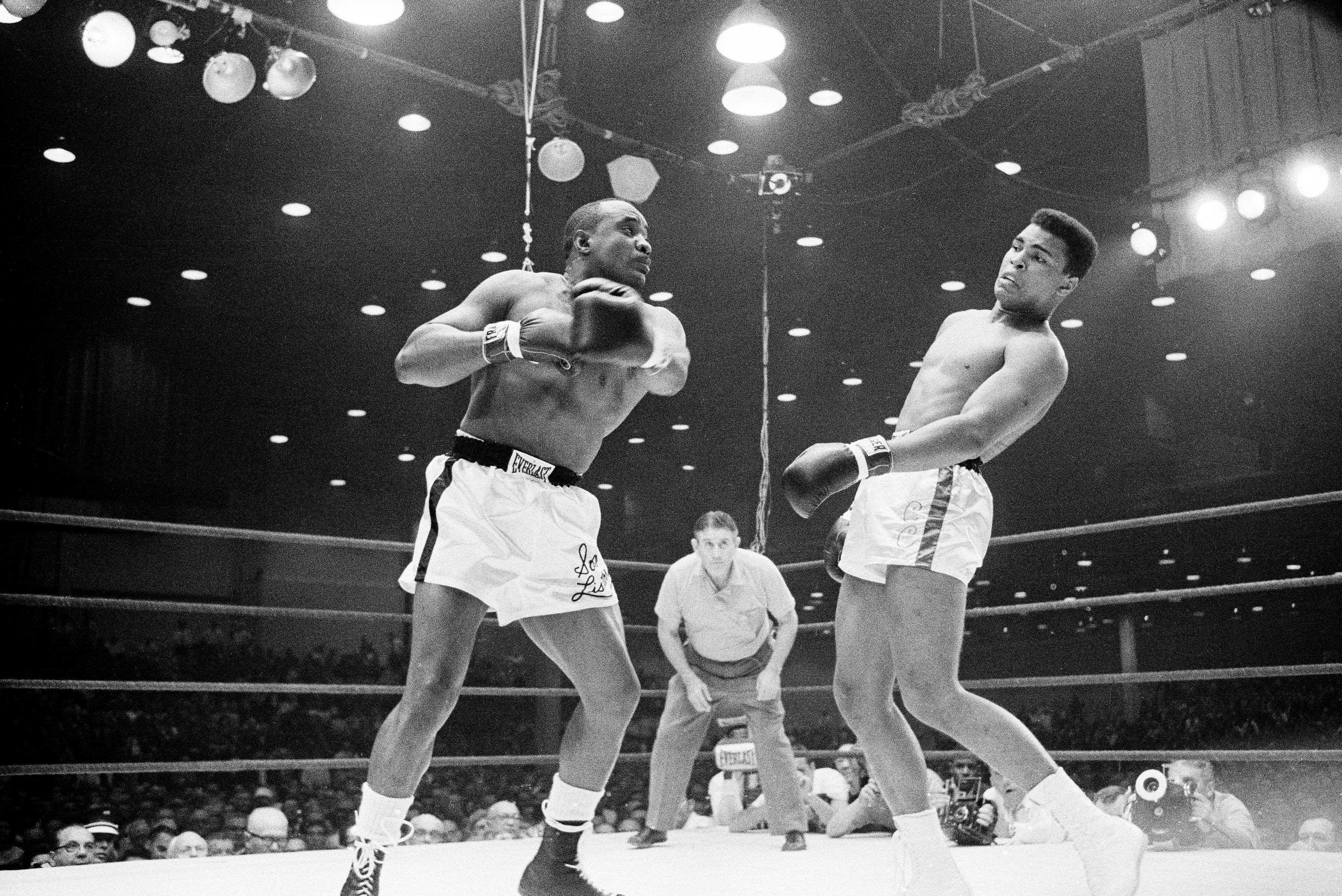 Sonny Liston throws a punch against Muhammad Ali