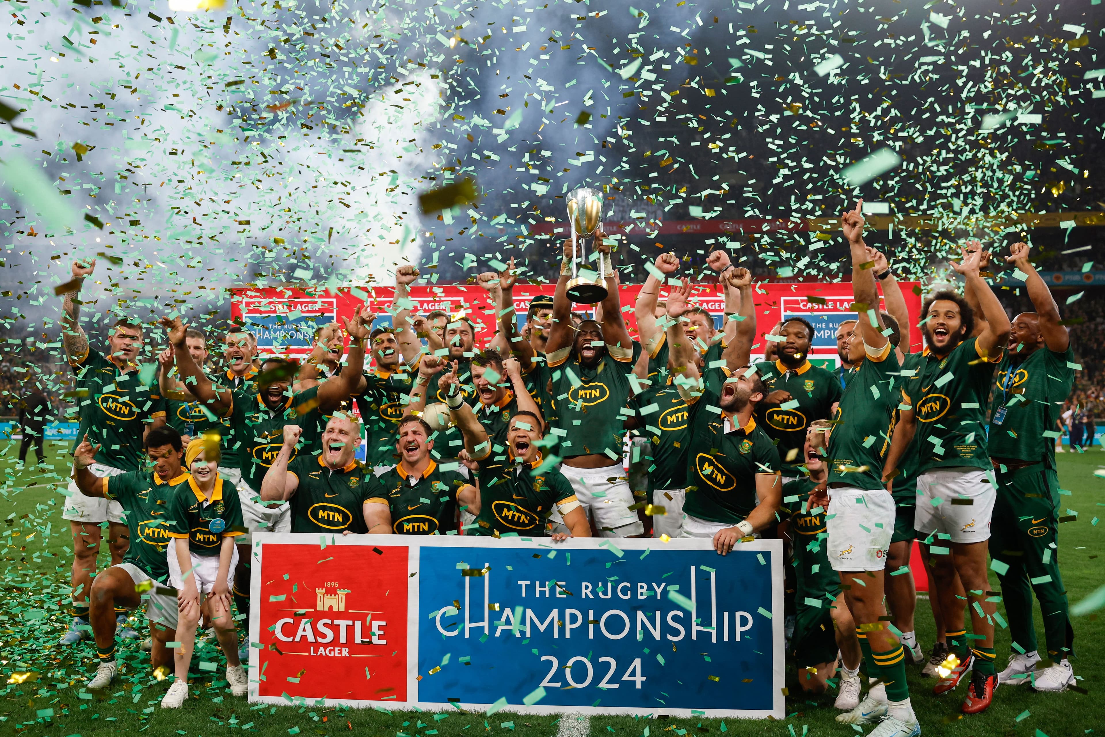 South Africa's flanker Siya Kolisi lifts the trophy