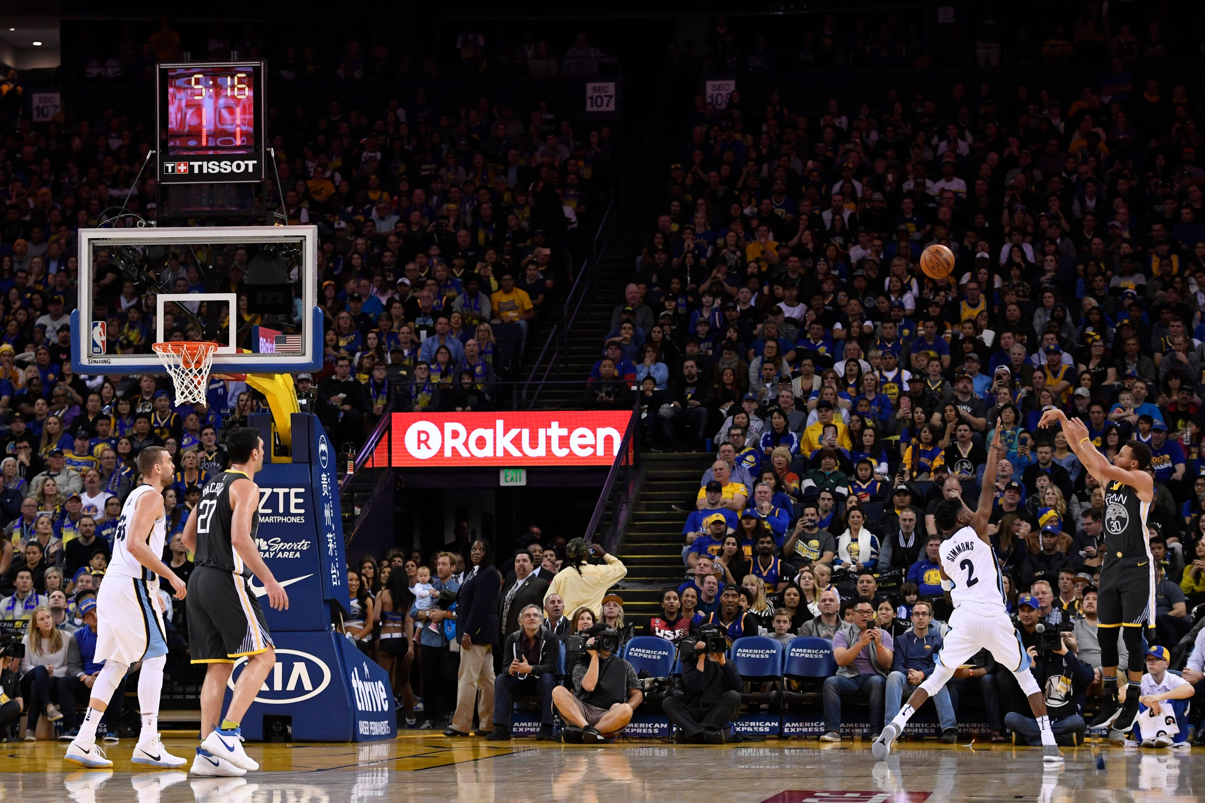 Stephen Curry and Kobi Simmons during the third quarter of their NBA game