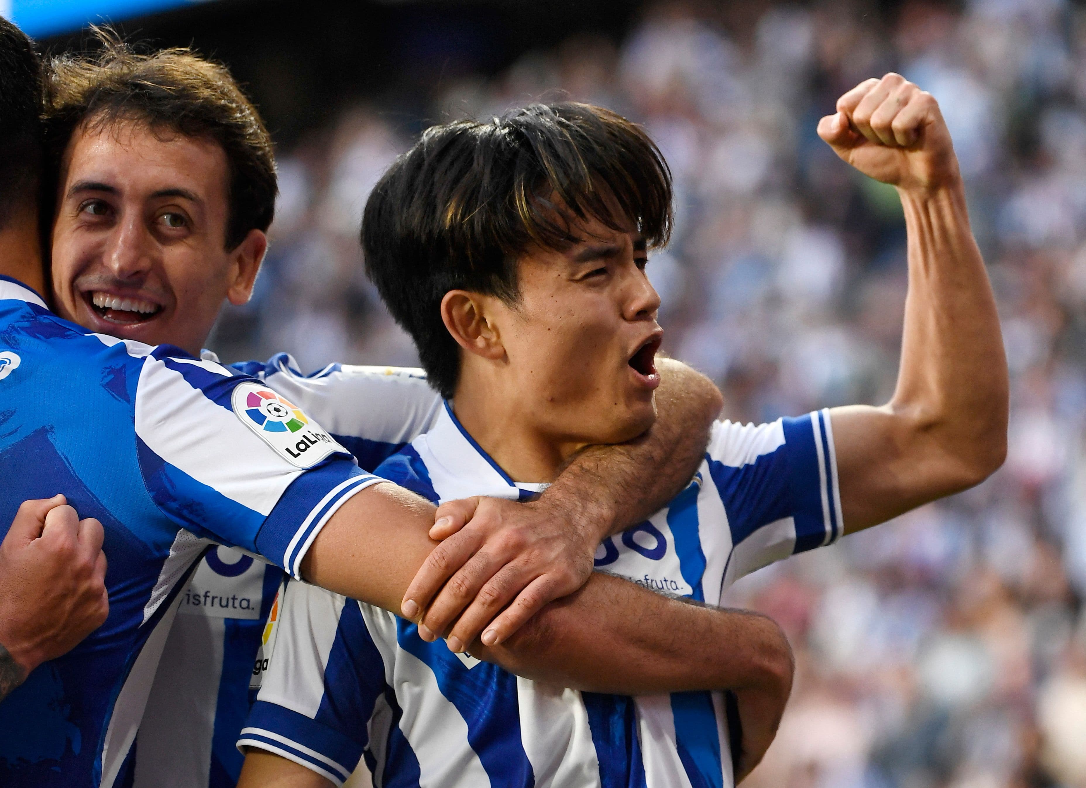 Takefusa Kubo celebrating with Mikel Oyarzabal