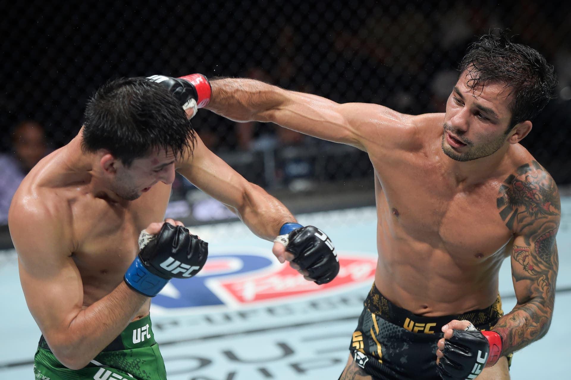 Alexandre Pantoja of Brazil punches Steve Erceg of Australia