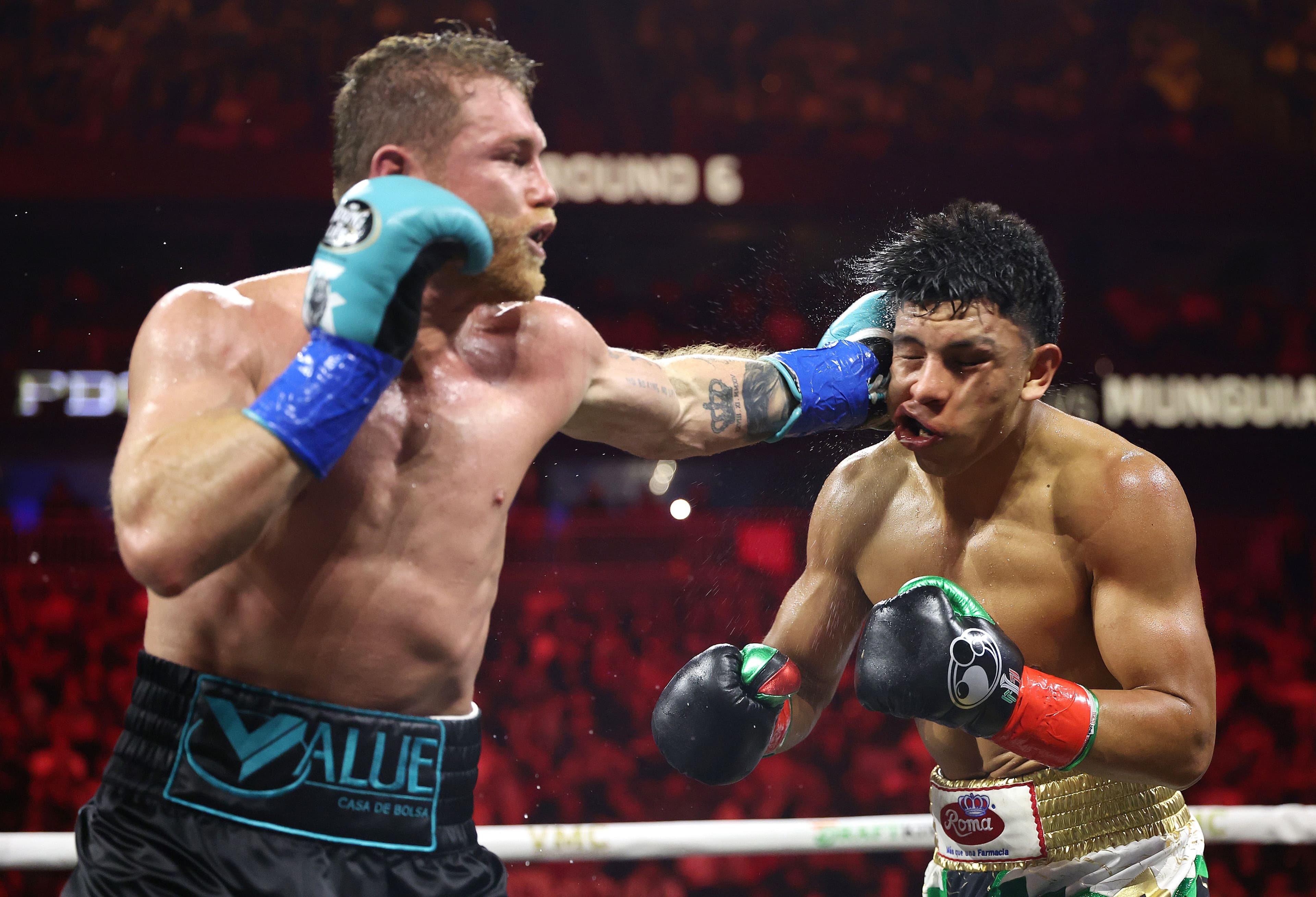 Canelo Alvarez lands a left against Jaime Munguia