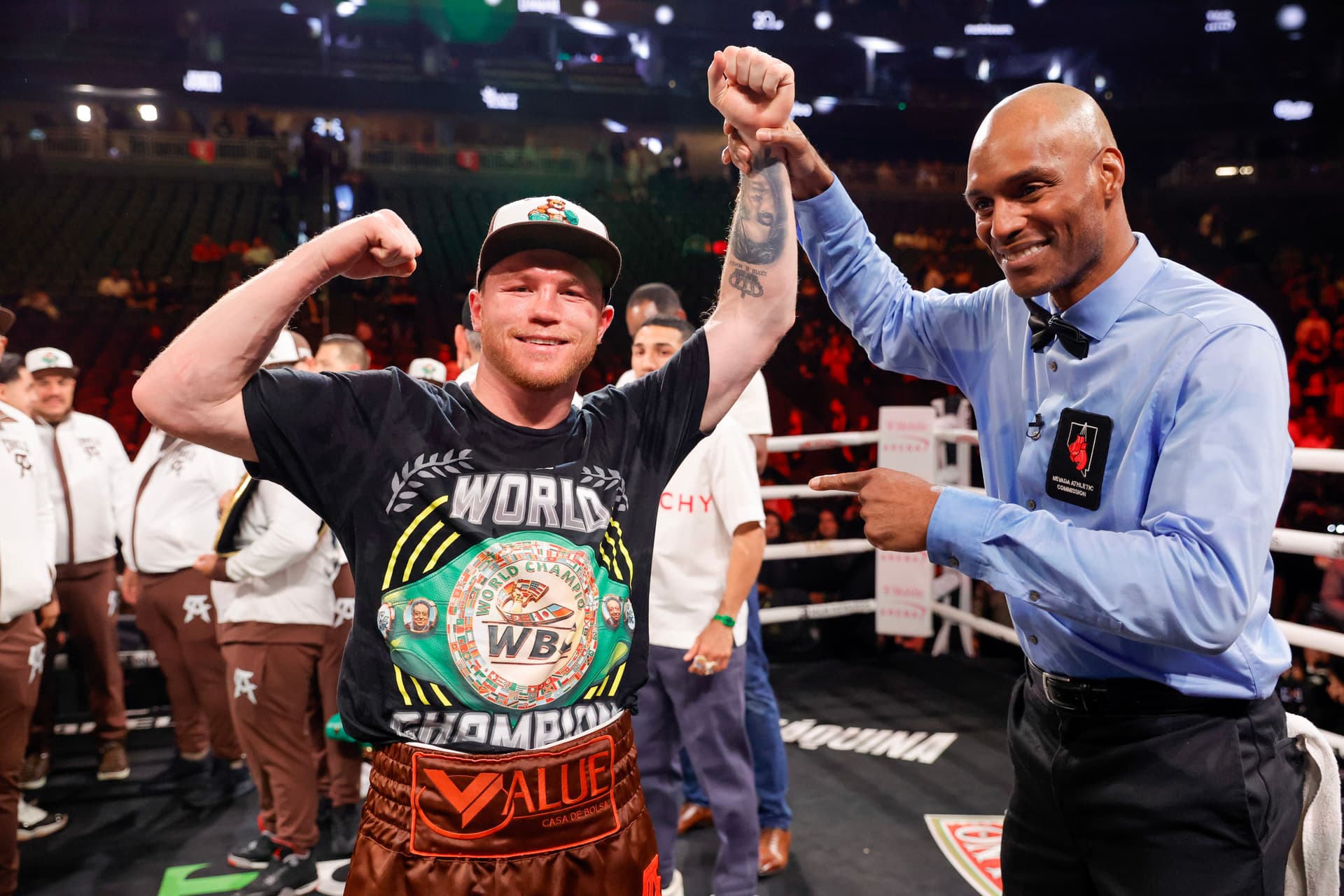 Canelo Alvarez poses for a photo with referee Harvey Dock