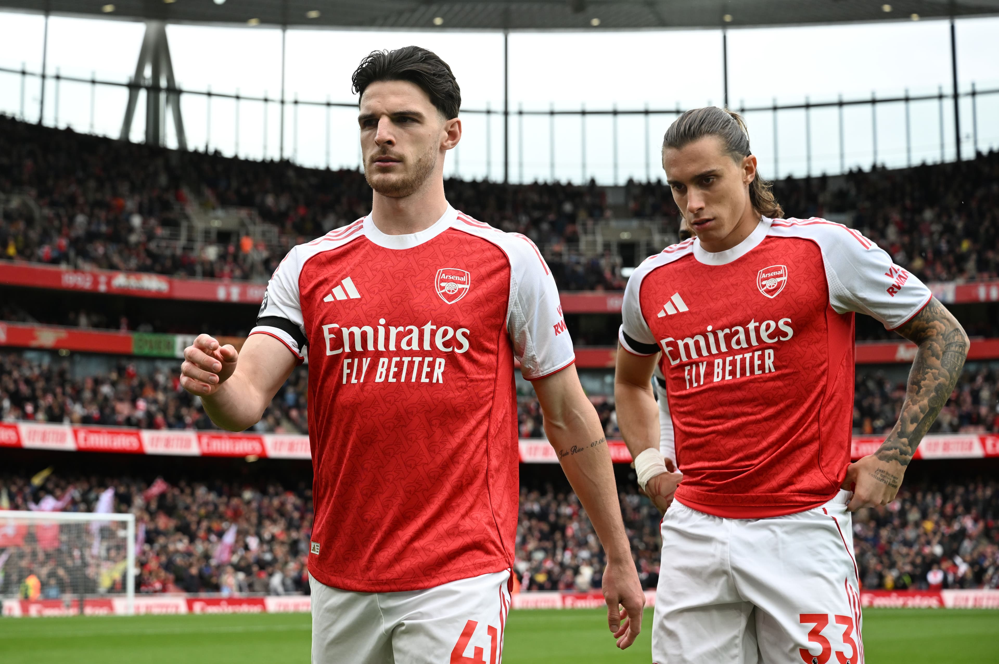 Declan Rice and Riccardo Calafiori of Arsenal take their positions on the pitch prior to the Premier League match