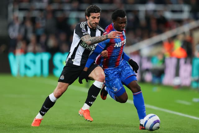 Eddie Nketiah of Crystal Palace battles for possession with Sandro Tonali