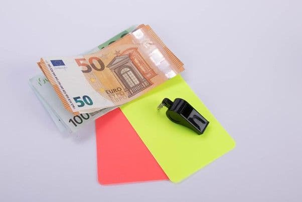 Euro banknotes with red and yellow referee cards