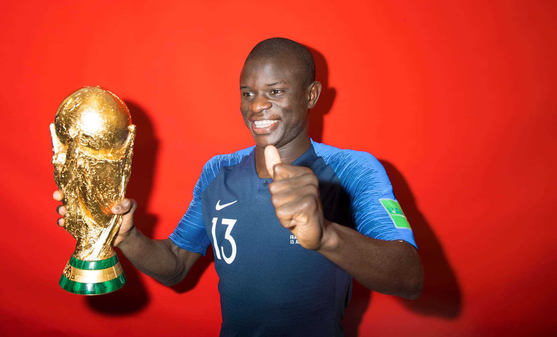 N'Golo Kante of France poses with the Champions World Cup trophy after the 2018 FIFA World Cup Russia Final