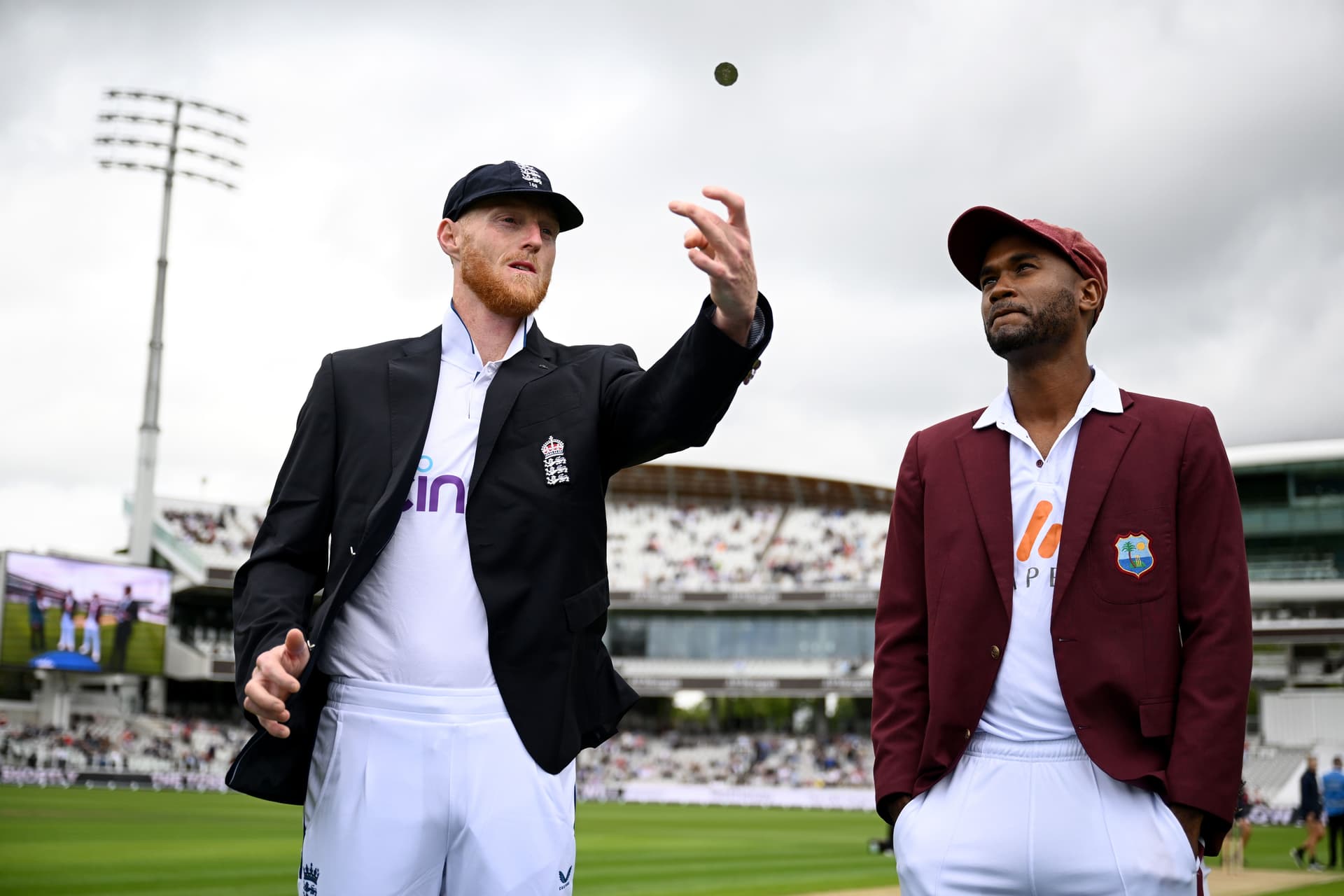 England captain Ben Stokes tosses the coin alongside West Indies