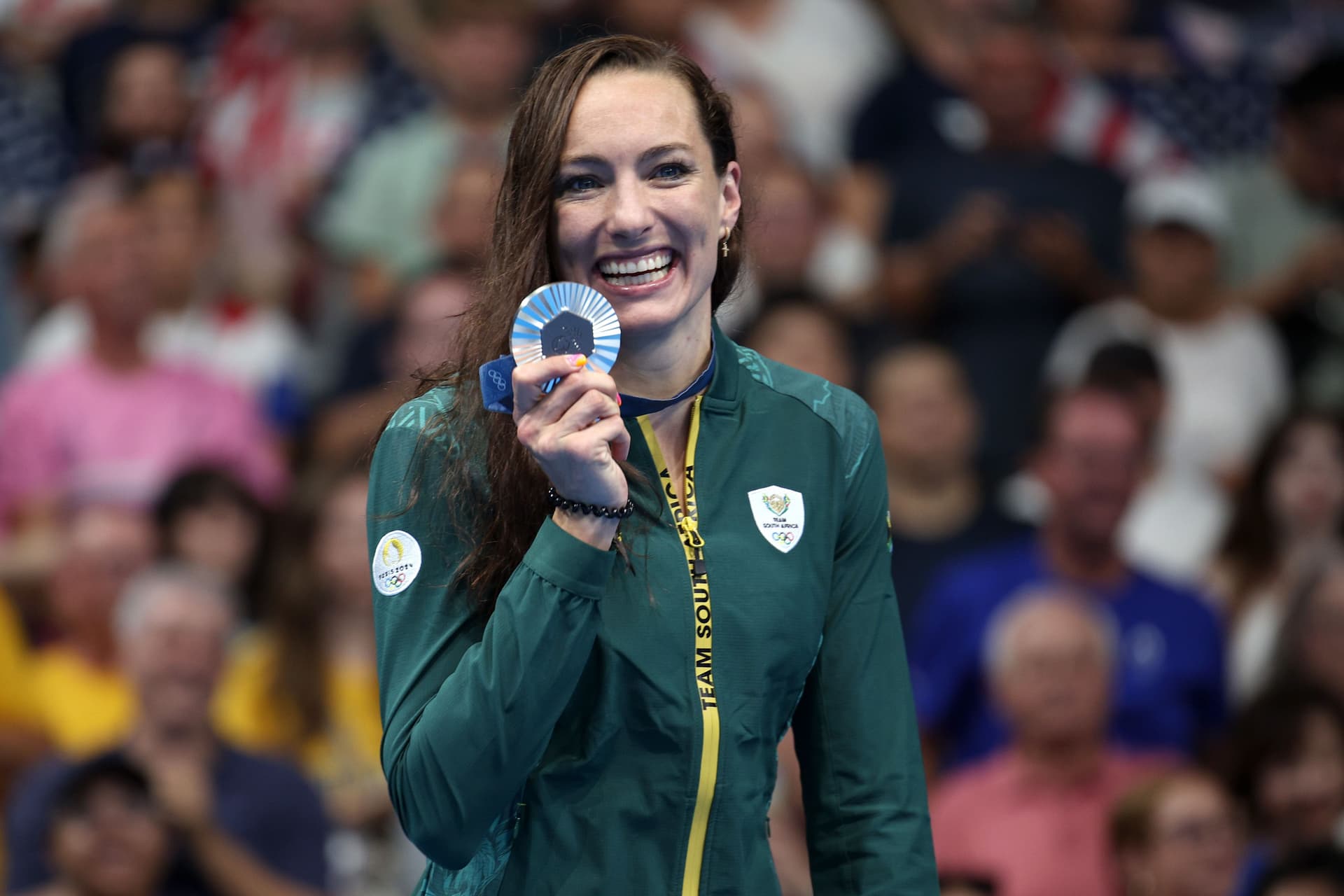 Silver Medalist Tatjana Smith of Team South Africa poses on the podium during the Swimming medal ceremony