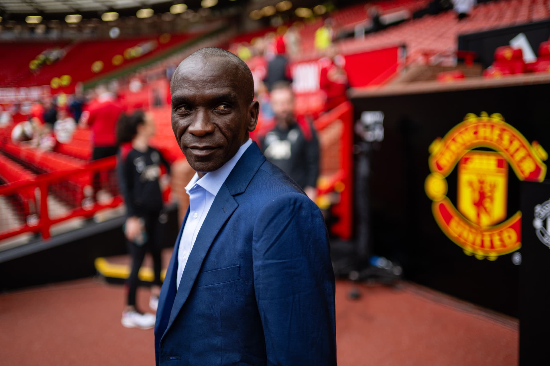 Eliud Kipchoge, Kenyan long-distance runner looks on prior to the Premier League match