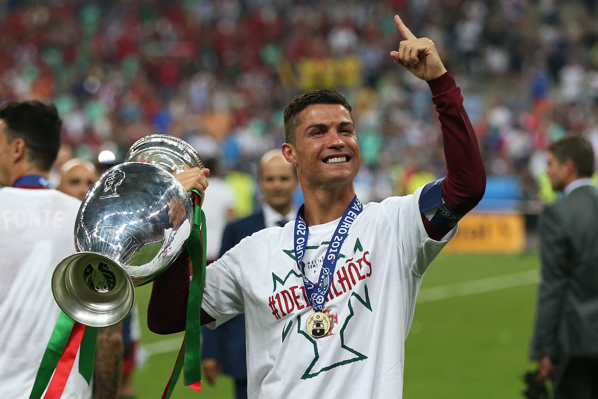 Cristiano Ronaldo of Portugal celebrates with the trophy following the UEFA Euro 2016 Final