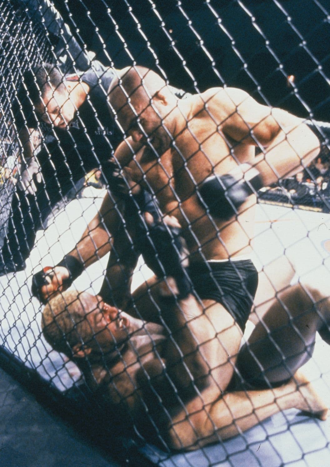 Randy Couture (top) punches Kevin Randleman