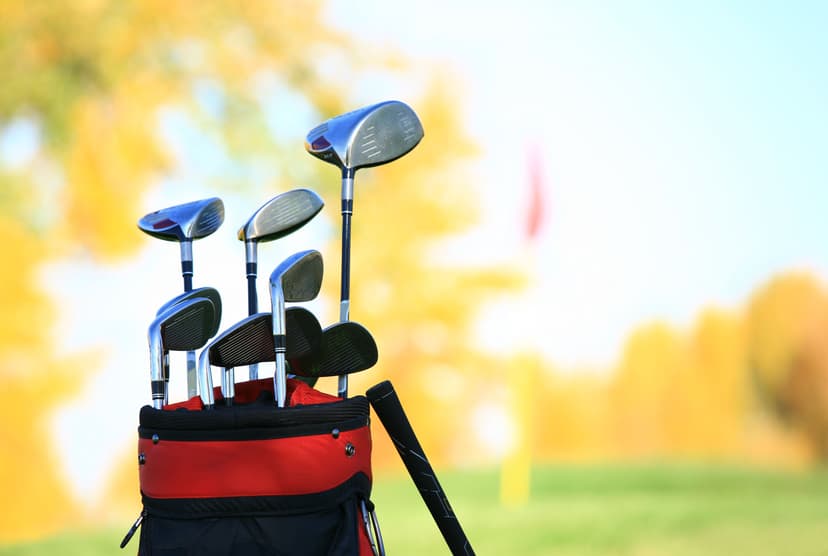 Golf Clubs and Equipment at a Beautiful Fall Course