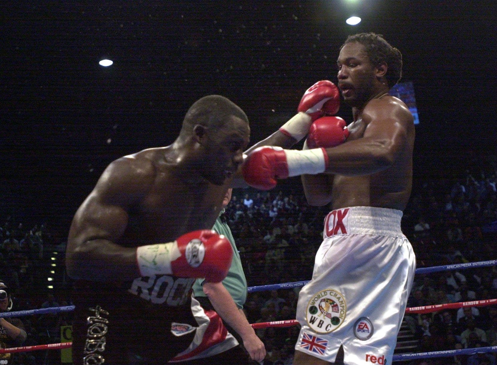 Hasim Rahman lands a jab to the face of the Lennox Lewis