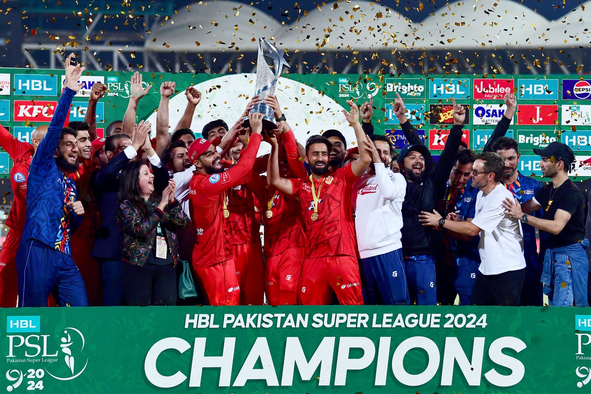 Islamabad United's players hold the Pakistan Super League (PSL) trophy