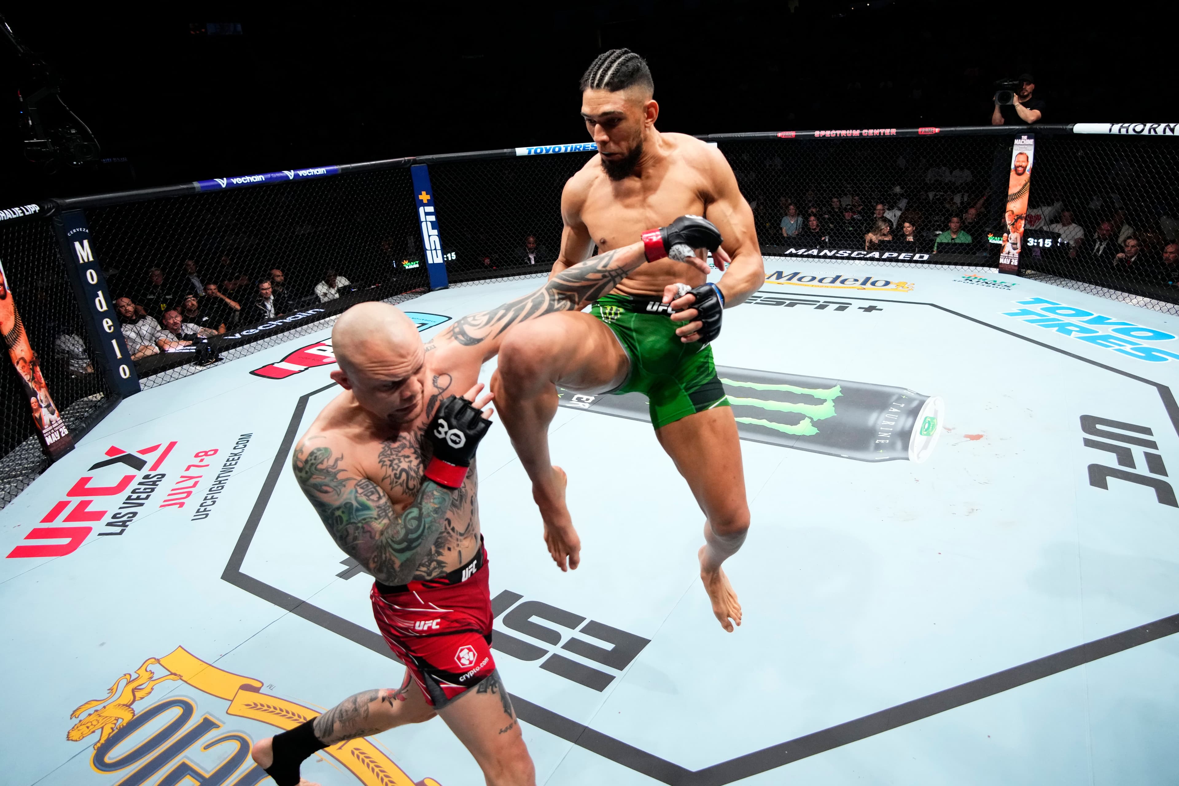 Johnny Walker of Brazil knees Anthony Smith in their light heavyweight fight during the UFC Fight Night event