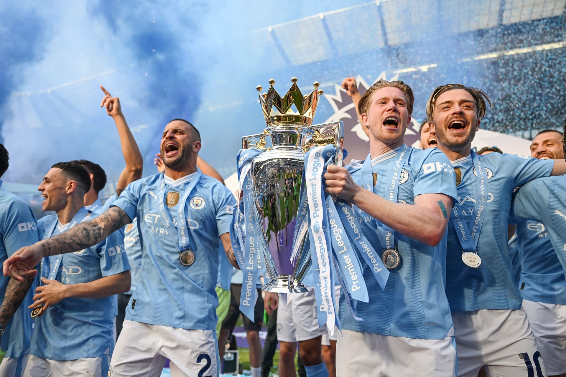Kyle Walker, Kevin De Bruyne and Jack Grealish lift the Premier League trophy