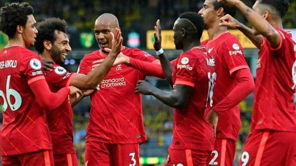 Liverpool football club celebrating on a football pitch- MPL.live
