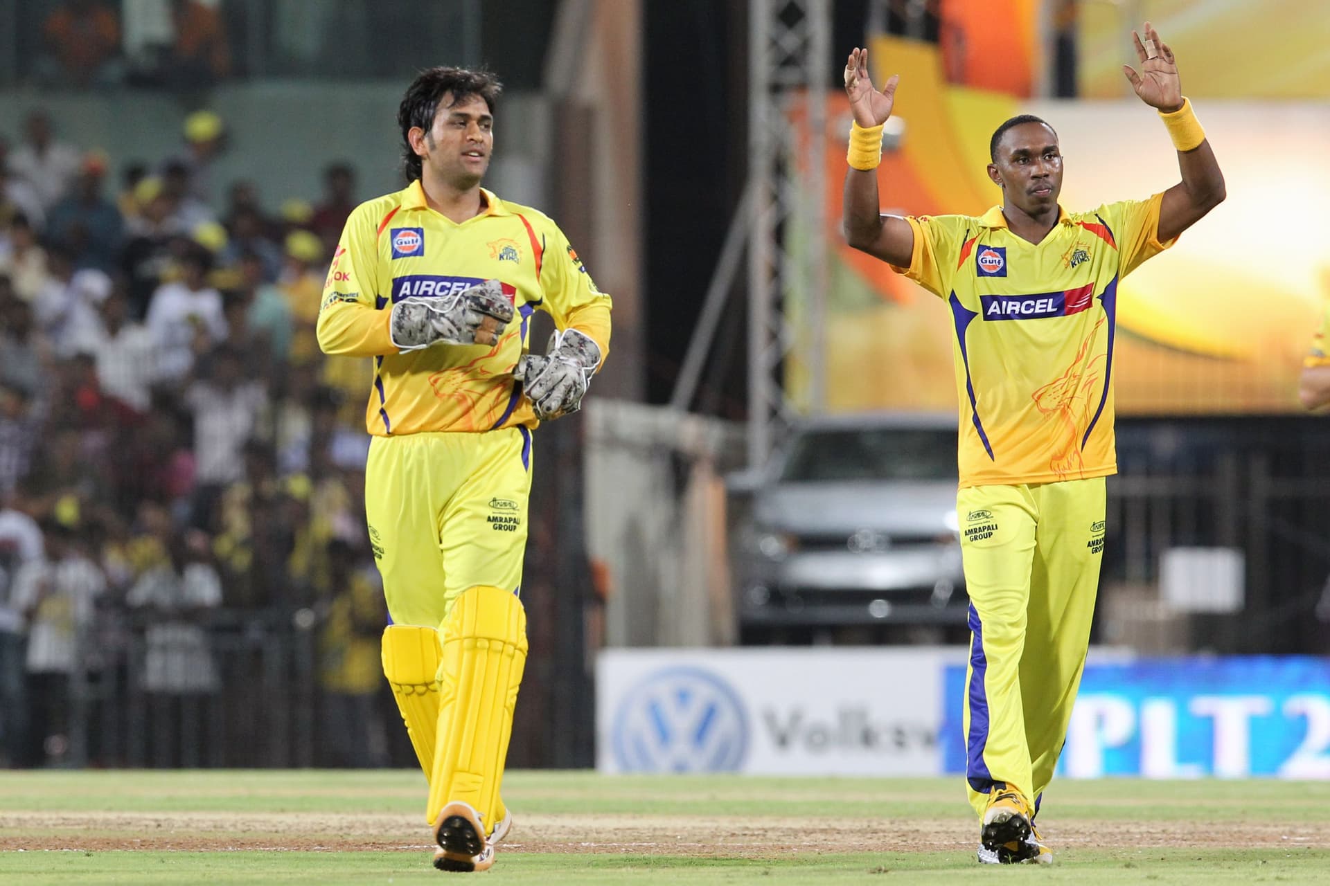 MS Dhoni and Dwayne Bravo move towards the pavilion..jpg