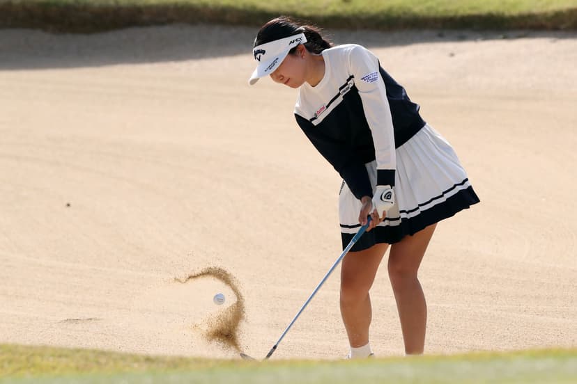 Riko Inoue of Japan hits out from a bunker