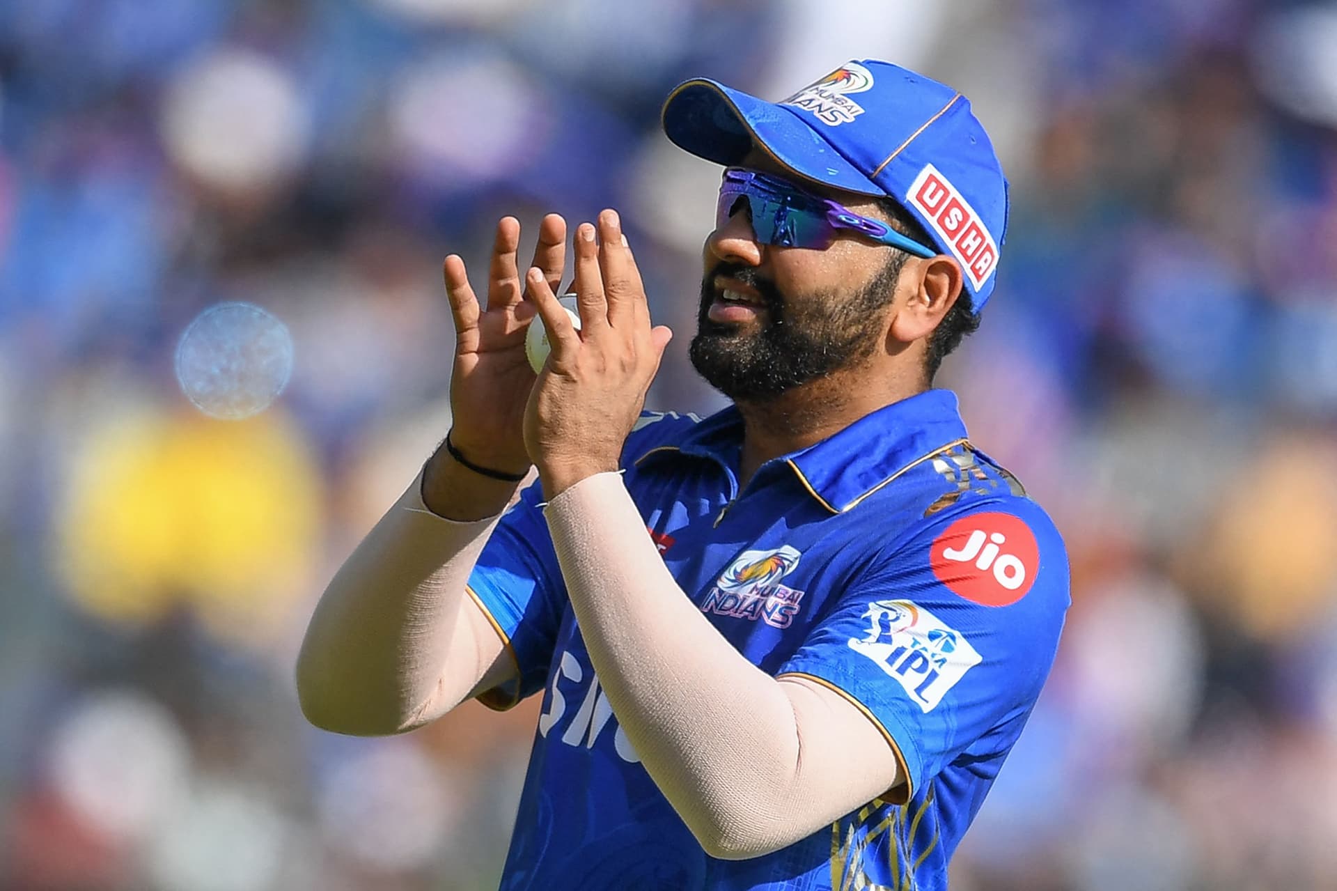 Rohit Sharma collects a throw