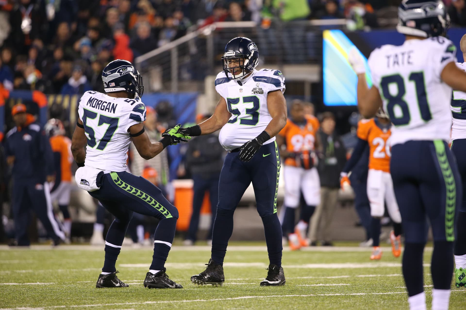 Malcolm Smith hides a recovered fumble under his jersey