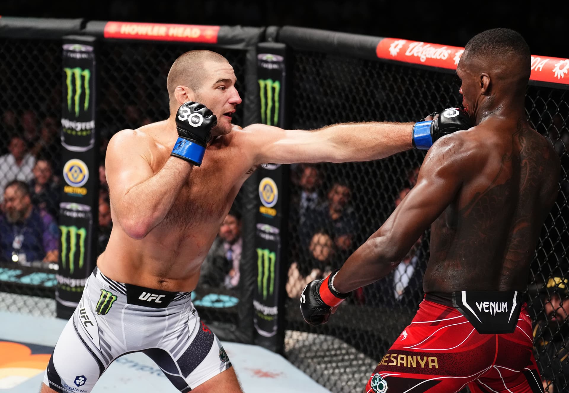 Sean Strickland punches Israel Adesanya