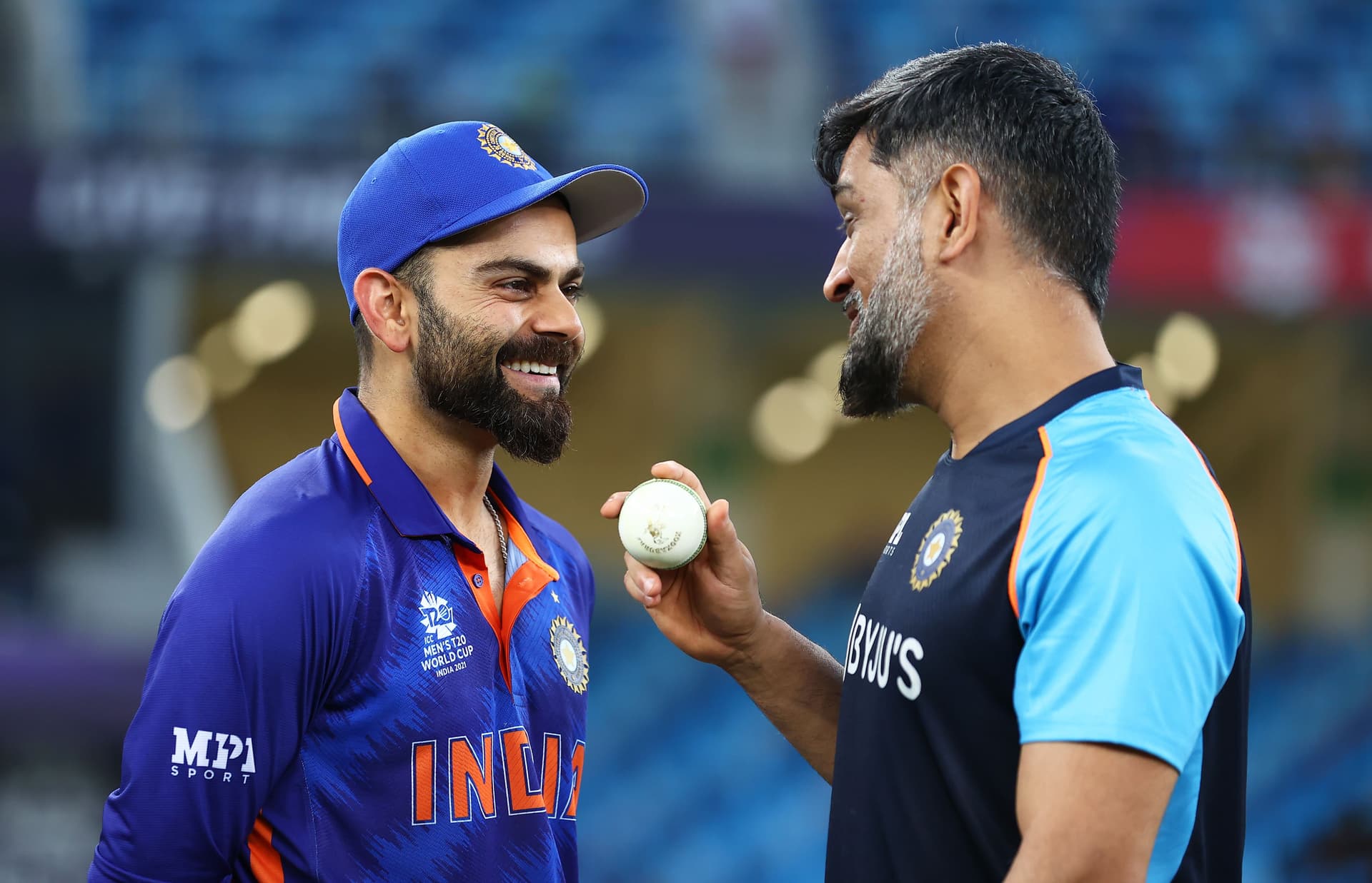 Virat Kohli of India interacts with MS Dhoni